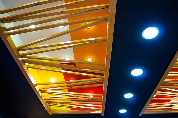 istock mod ceiling with small lamps and wooden beams 501093118