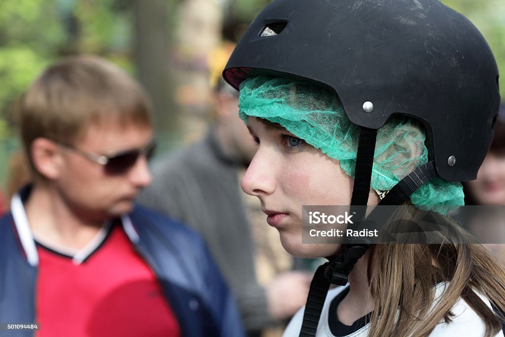 Girl in helmet Profile girl face in the black helmet 2015 Stock Photo