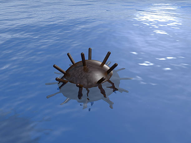 Old rusty underwater mine in the sea.
