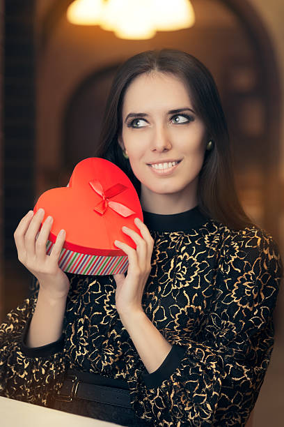 Beautiful Elegant  Woman Holding Heart Shape Gift