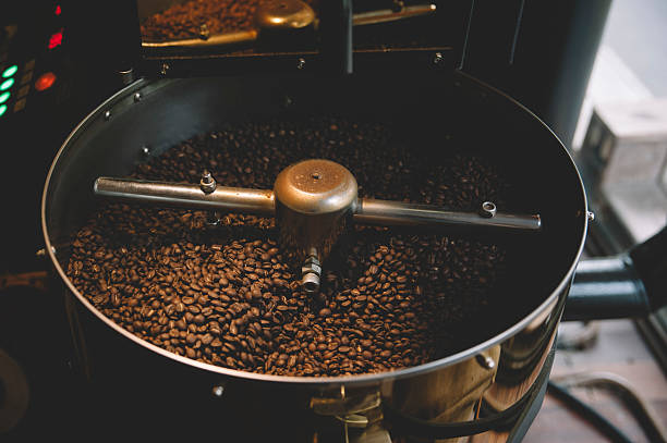 istock freshly roasted coffee beans n a coffee roaster 501097890