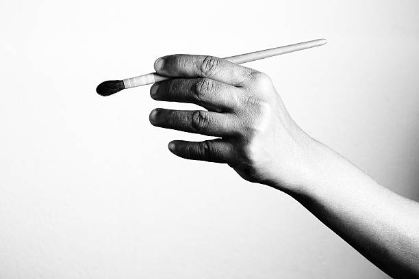 istock artist hand with brush 501119234