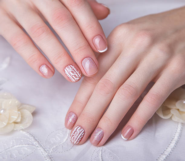 istock Snow White manicure on female hands. Winter nail design 501120258