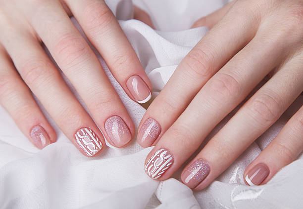 Snow White manicure on female hands. Winter nail design