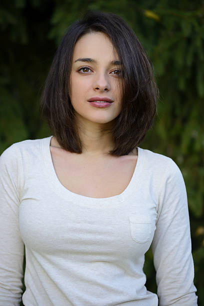 istock Beautiful young woman with pine tree background 501121224