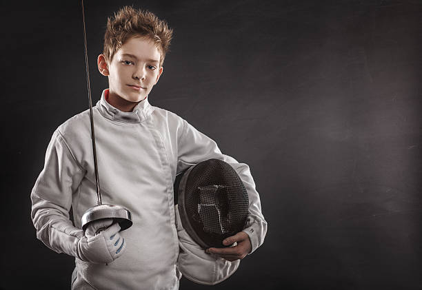 Fencer with fencing mask stock photo
