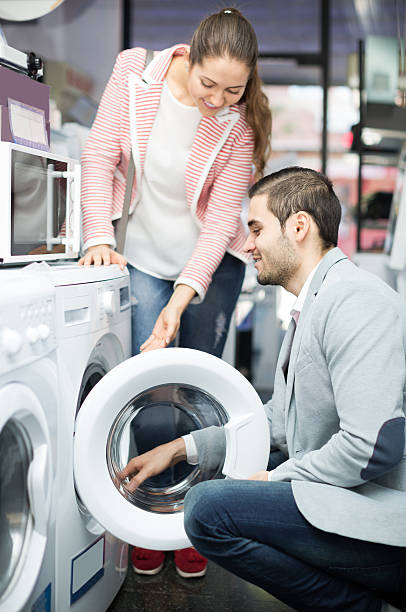 istock salesman and customer in store 501125516