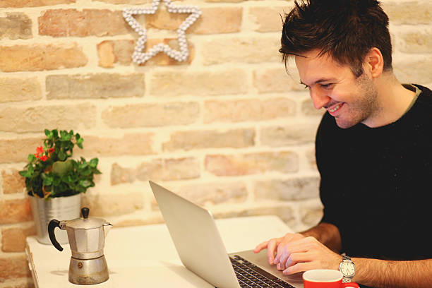 istock Young man typing at the laptop 501125688