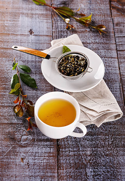 istock Green tea over rustic wooden background 501125774