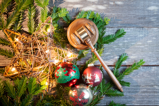 Rustic handmade Lighted christmas star on old wood with pine tree and bulbs with gavel