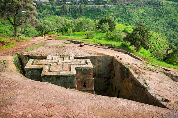 Church of St. George (Bet Giyorgis) in Lalibela, Ethiopia The rock-hewn church of St. George (Bet Giyorgis) in Lalibela, Ethiopia. Built in the late 12th or early 13th century. the church of saint george lalibela ethiopia stock pictures, royalty-free photos & images