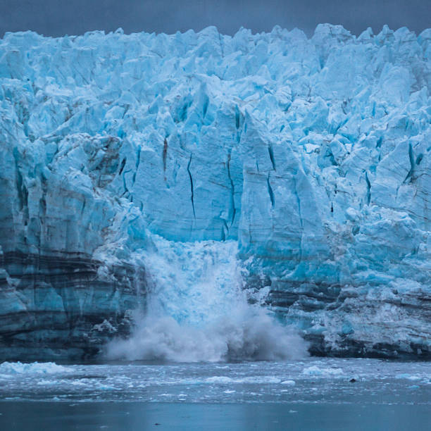 istock Mass of ice calves from the glacier 501129828