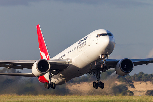 Melbourne, Australia - February 6, 2011: Qantas Boeing 767 carrying registration VH-OGE named 'City of Orange' takes off from Melbourne International Airport  in Tullamarine Victoria. 