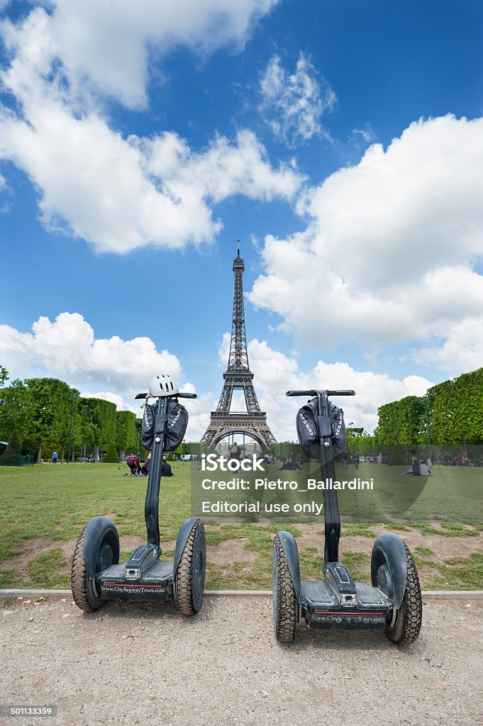 Segway parked in front the Eiffel Tower. Paris, France - May 14, 2014: Segway parked in front the Eiffel Tower in Paris.  Exploration Stock Photo