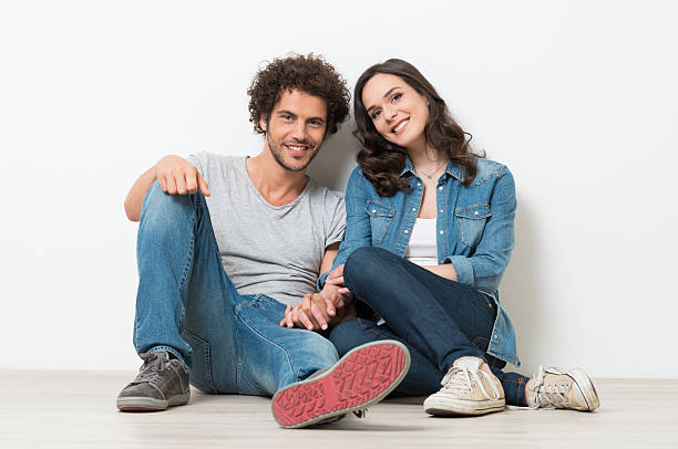 istock Young couple sitting on the floor 501133707