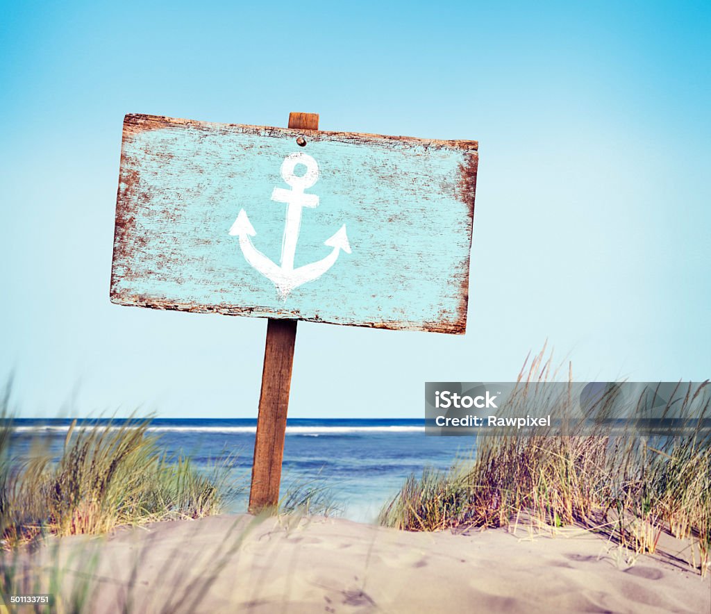 Blue Painted Wood Label on the Beach Beach Sign Stock Photo