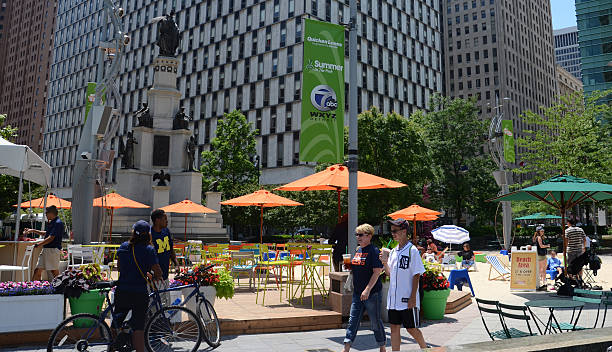 People enjoying Campus Martius park in Detroit, MI stock photo