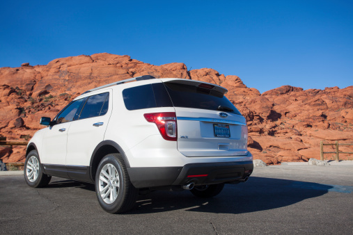 Las Vegas, USA - June 30, 2014: A 2014 white Ford Explorer in Red Rock Canyon in Las Vegas. the Ford Explorer is a 7 seater SUV that is sold in the USA.