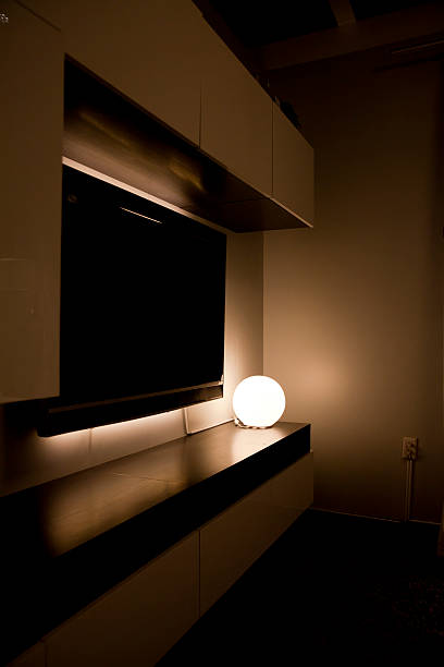 istock Round table lamp in the dark living room 501135631