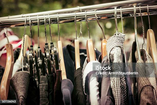 Clothes On A Rack On A Flea Market Stock Photo - Download Image Now - Garage Sale, Thrift Store, Abundance