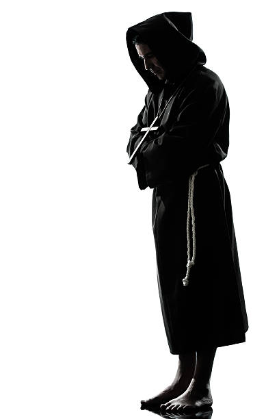 istock man monk priest silhouette praying 501137151