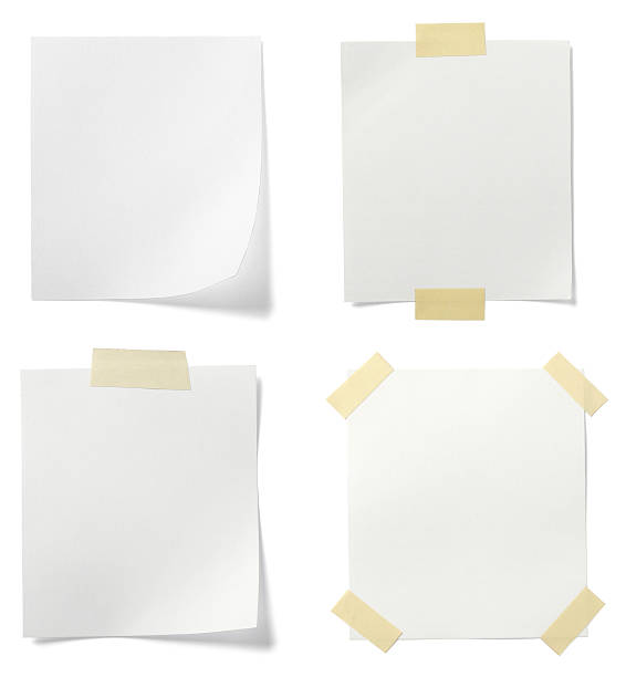 istock Four blank white pages taped to background 501139081
