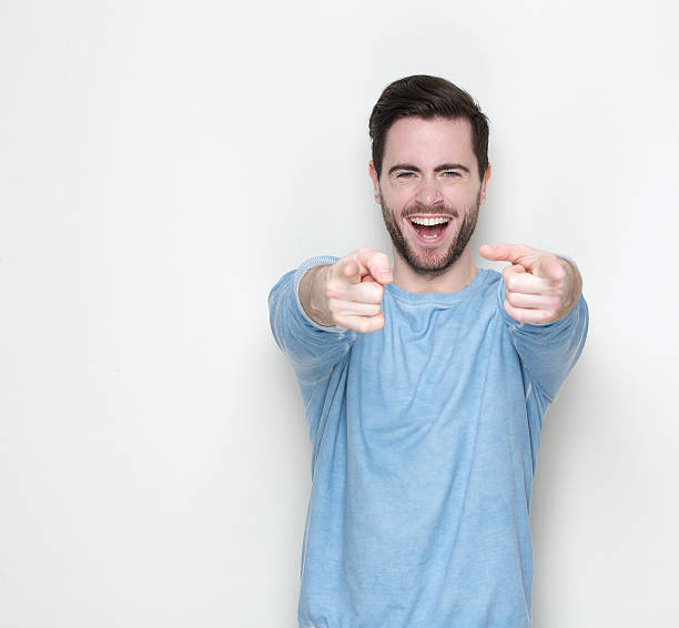 istock Cheerful young man pointing fingers 501140203