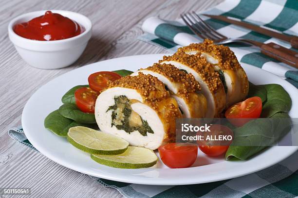 Chicken Breast Stuffed With Spinach And Cheese On A Plate Stock Photo - Download Image Now