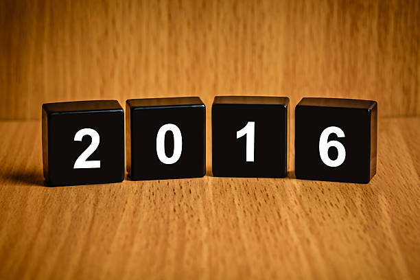 istock 2016 Happy new year word on black block 501151102