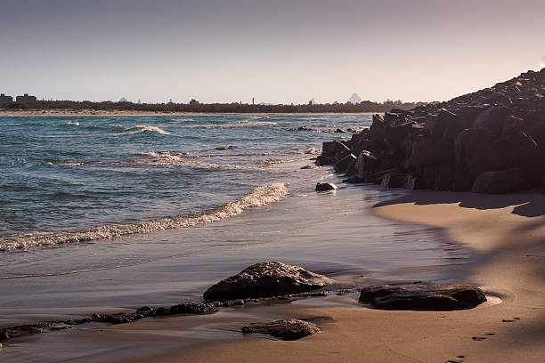 Sunrise On The Beach The sun rises on the beach in Caloundra, Queensland, Australia caloundra stock pictures, royalty-free photos & images