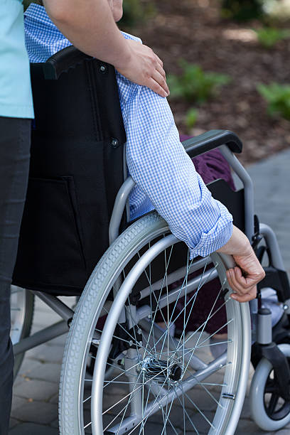 istock Nurse and disabled in a garden 501152939