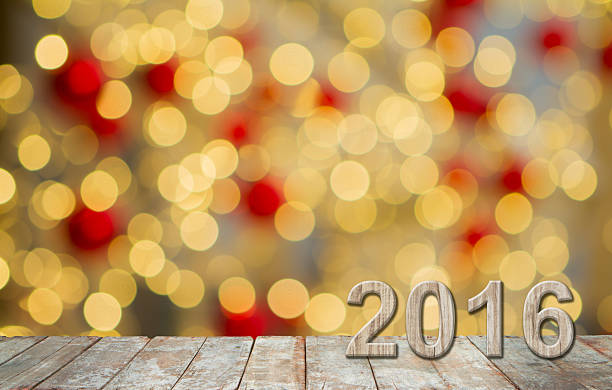 istock New year 2016,  Wooden with sparkling bokeh background. 501153806