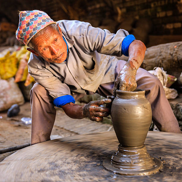 istock Nepali potter working on the pottery square in Bhaktapur 501155295