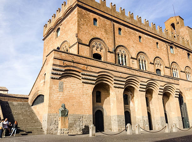 Local people gathering by Palazzo del Capitano del Popolo, Orvieto Orvieto, Italy - September 26, 2015: Local people gathering by Palazzo del Capitano del Popolo which used as a meeting place. This city hall has the combination of Medieval and Renaissance architecture. orvieto stock pictures, royalty-free photos & images