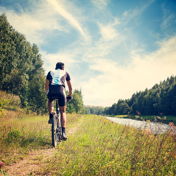 istock Man Riding a Bicycle on Nature Background 501155445