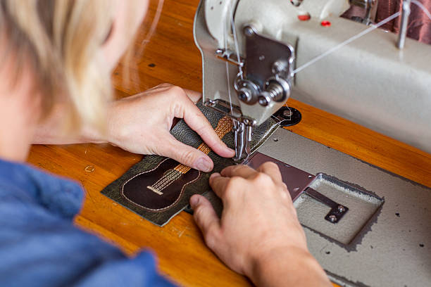 istock Woman Sews Guitar Wallet 501155491