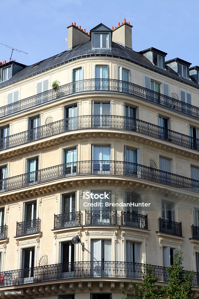 Elegant Curve The corner of an ornate building in Paris. Apartment Stock Photo