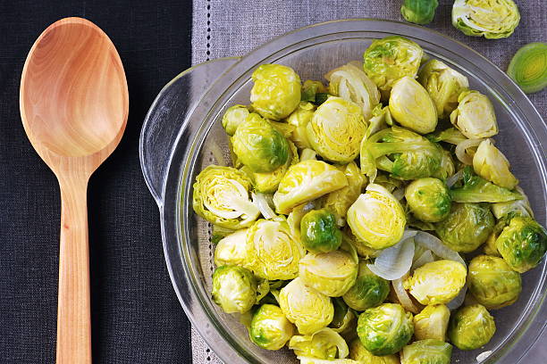 istock Brussels sprouts and leeks stew in the glass plate 501156746