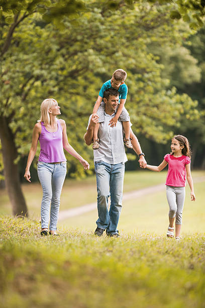 istock Happy family taking a walk in the park. 501157220