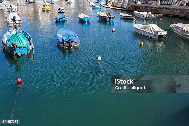 Boats Moored In A Calm Harbour In Malta Stock Photo - Download Image Now - Architecture, Backgrounds, Bay of Water