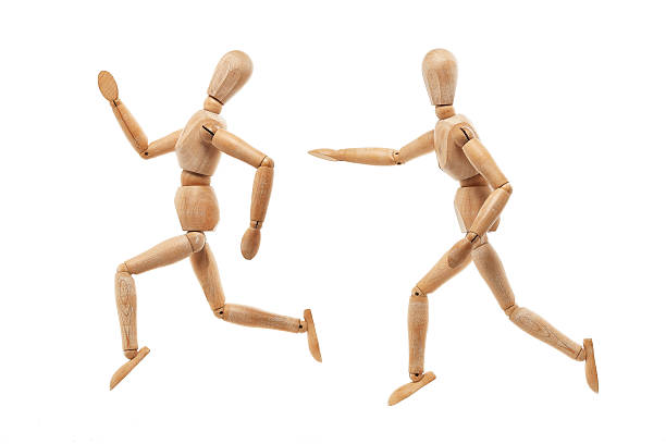 istock Running and chasing wood men 501157617