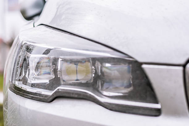 istock Close-up on a car headlight. Moder car exterrior. 501160180
