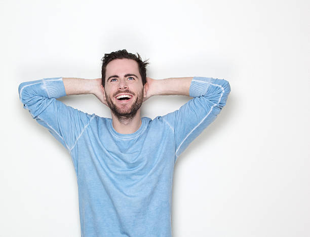 istock Smiling man with hands in hair looking up 501169161