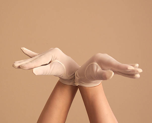istock woman modeling vintage formal white gloves silly pose 501169521