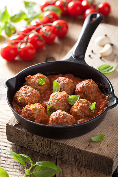 istock meatballs with tomato sauce in black pan 501171385