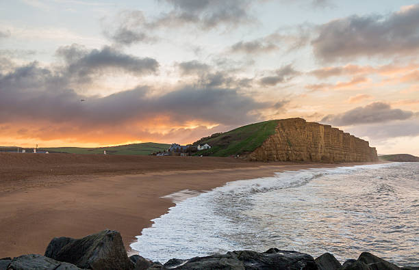 istock Sun rises at West Bay Dorset in UK 501171759
