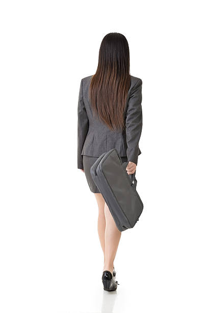 Asian businesswoman walking with a handbag stock photo