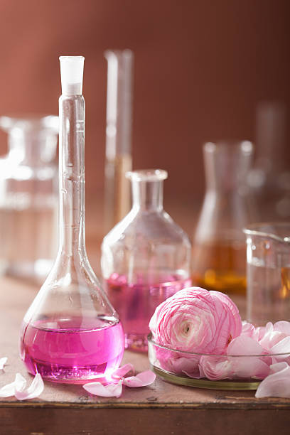 istock alchemy and aromatherapy set with ranunculus flowers flasks 501172761