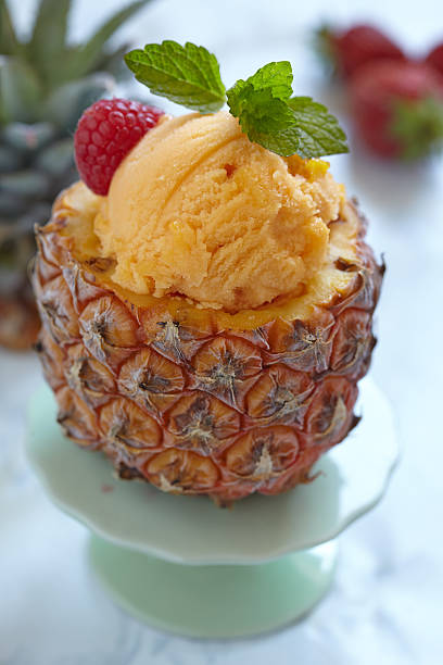 istock Fruit sorbet ice cream in small pineapple 501173367