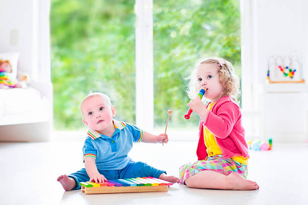 istock Little kids playing music with xylophone 501173889